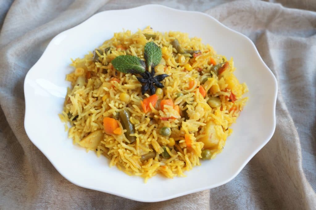 The BEST collection of 29 Instant Pot Indian Vegetarian Recipes from the best Indian food blogs! You can find a variety of vegetarian curries, lentils, beans and rice recipes from all over India. Vegetable Pulao in a white bowl made in Instant Pot Pressure Cooker