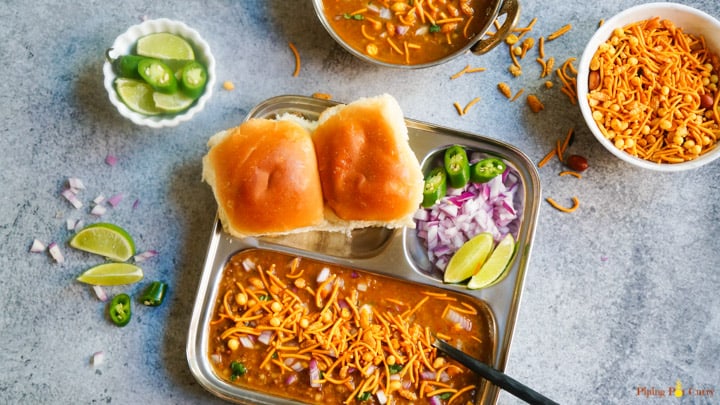 A delicious Mumbai breakfast, Misal Pav made as a one-pot recipe in the Instant Pot. Misal is a spicy sprouts curry cooked with onions, tomatoes, ginger, garlic and coconut. This is then topped with onions, lemon juice, farsan and enjoyed with pav (dinner rolls)