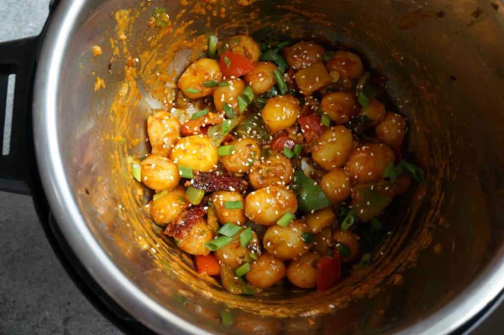 Flavorful and easy Garlic Chili Potatoes, made with steamed potatoes, garlic, chili sauce and honey, sprinkled with green onions and sesame seeds. Enjoy them as an appetizer or side! Garlic Chili potatoes in instant pot