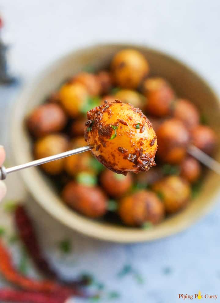 Spicy Bombay Potatoes or Masala Aloo, is baby potatoes cooked with aromatic spices. Perfect to serve as appetizer or a side dish, these delicious Bombay Potatoes take just 20 minutes to make in the Instant Pot | #babypotatoes #instantpot #potatoes #pressurecooker #bombaypotatoes #spicypotatoes | pipingpotcurry.com Closeup of Spicy Bombay Potatoes made in Instant Pot Pressure Cooker