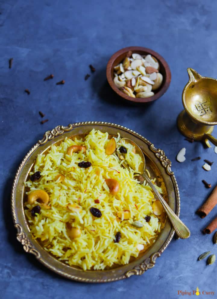 Meethe Chawal or Zarda Rice is a sweet and rich rice preparation loaded with dry fruits, sugar and ghee. This aromatic sweet saffron flavored rice is a royal dessert made on special occasions and festivals | #zarda #sweetrice #chawal #rice #dessert #glutenfree #vegetarian #pipingpotcurry | pipingpotcurry.com Zarda. Meethe Chawal, which is sweet rice made in the Instant Pot