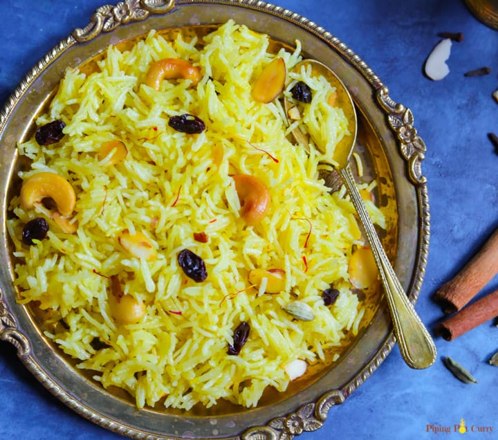 Meethe Chawal or Zarda Rice is a sweet and rich rice preparation loaded with dry fruits, sugar and ghee. This aromatic sweet saffron flavored rice is a royal dessert made on special occasions and festivals | #zarda #sweetrice #chawal #rice #dessert #glutenfree #vegetarian #pipingpotcurry | pipingpotcurry.com Zarda. Meethe Chawal. Sweet Rice in Instant Pot