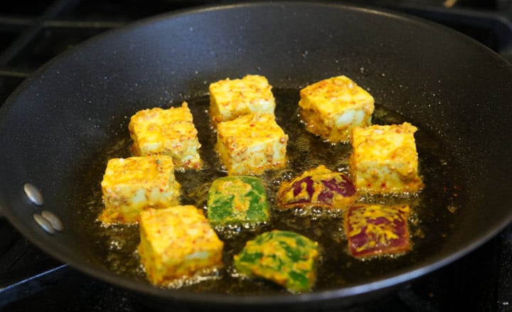 Fry marinated paneer in a pan