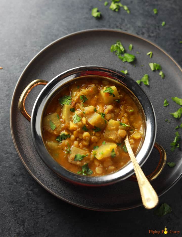 Lauki Chana Dal served in a bowl with cilantro sprinkled on the side