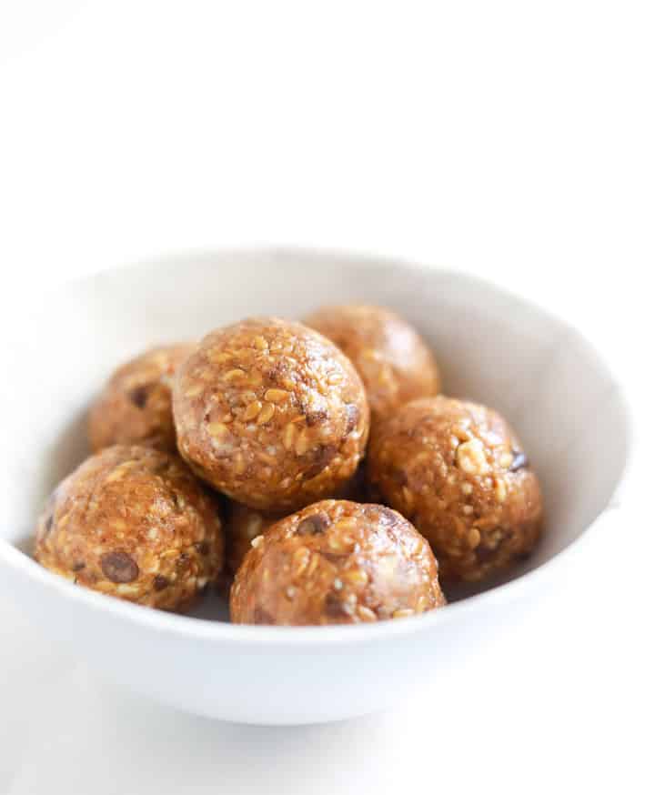 Almond Date Chocolate Chip Energy Balls in a white bowl
