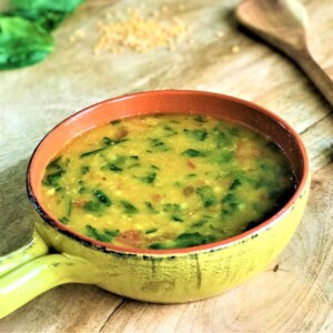 Lentils with Spinach served in a yellow bowl